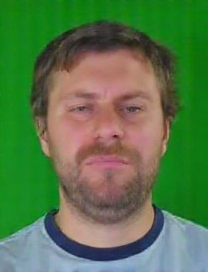 maroi700's face in the photo, he is wearing a Manchester City jersey, against a green background
