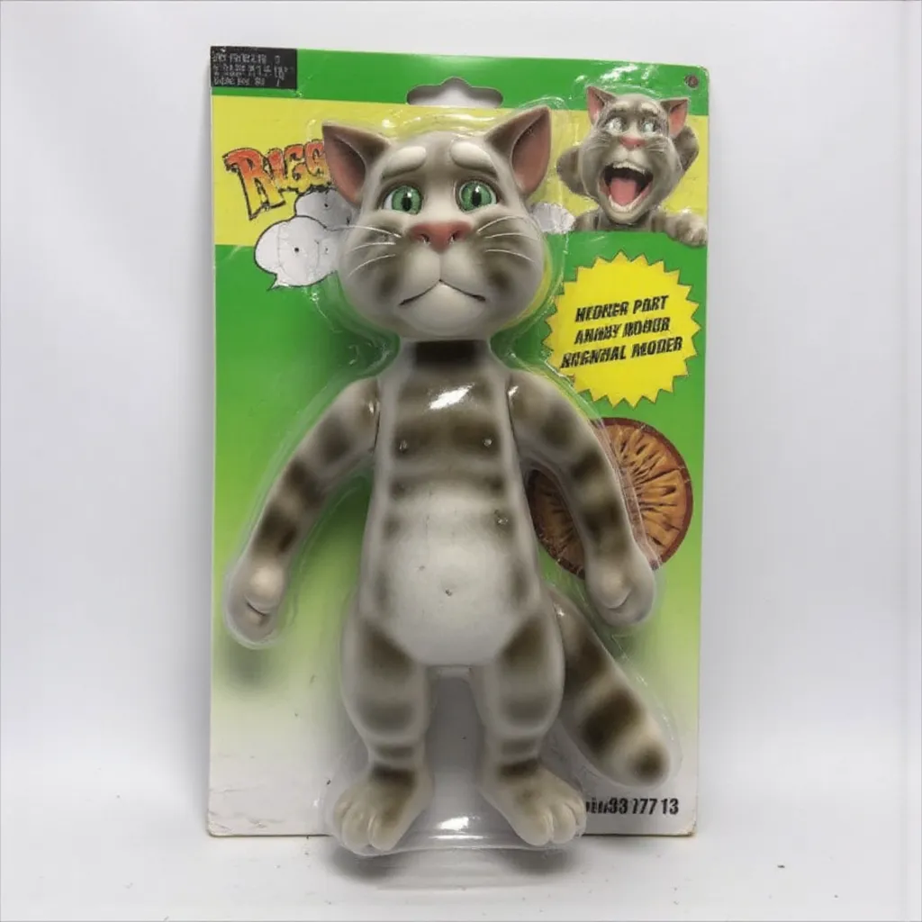 The image is a photograph of a packaged action figure of Cat cartoon 3d model lanky with gray fur and green eyes .
