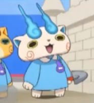 Komasan  (Voz español latino)